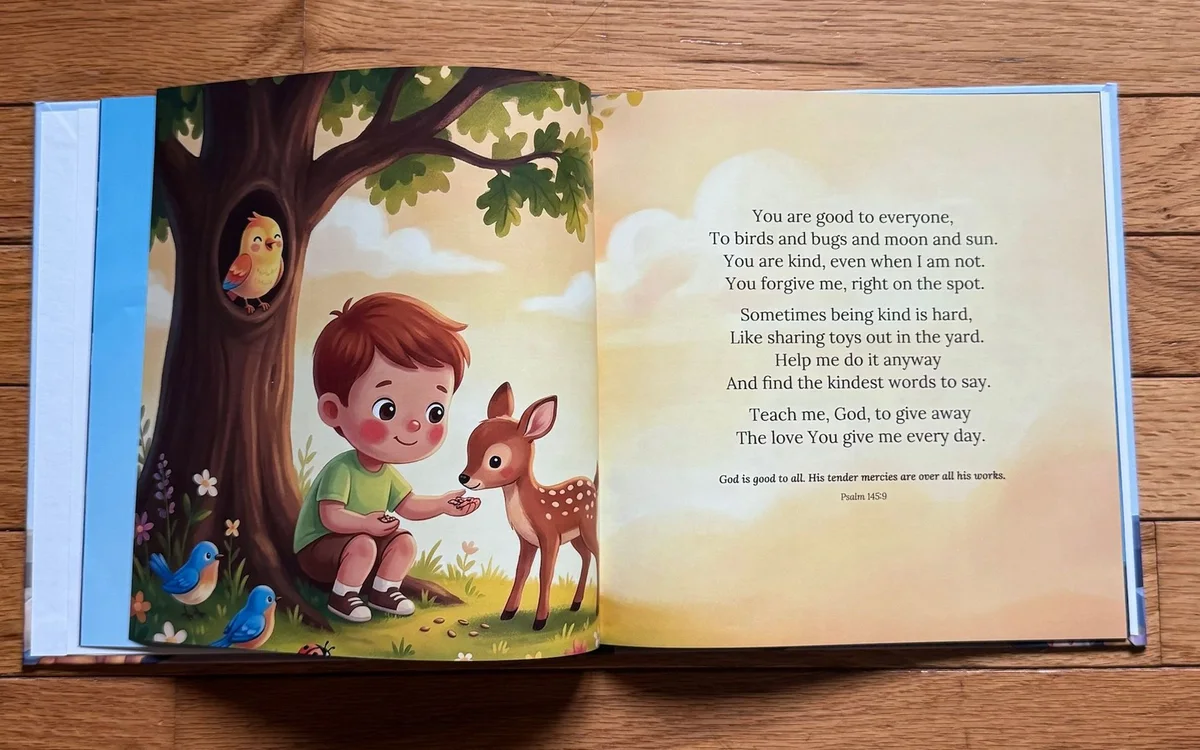 A printed copy of Little Prayers open at the kindness prayer spread, with a boy feeding a fawn under a tree.